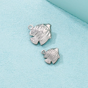 Polished silver stainless steel hollow tropical fish charms with intricate engraved texture
