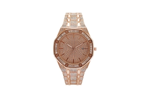 Macro detail of rose gold octagonal bezel set with white crystals and date window