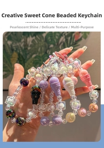 Detail of colorful acrylic beads and ice cream cone charm on a handmade keychain