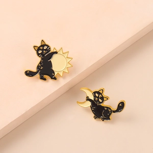 Set of black cat enamel pins with sun and moon designs in gold and black finish