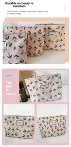 Close-up of floral corduroy cosmetic bag featuring vintage tulip patterns and gold zipper