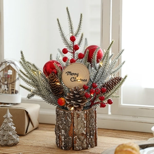 Christmas centerpiece with pine branches, red berries, and cones on a wooden base