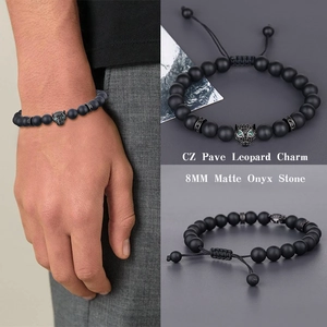 Detail view of 8mm matte onyx leopard bracelet with CZ pave and adjustable braided cord