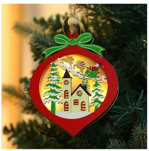 Detailed view of an illuminated wooden Christmas hanging sign with warm LED lights