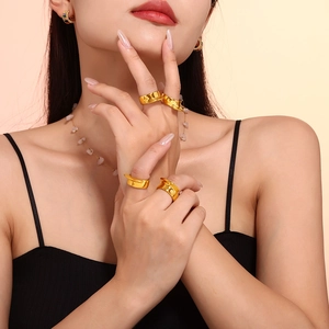 Set of four minimalist 18k gold plated stainless steel chunky convex rings on model