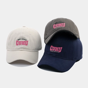 Detailed view of 3D letter embroidery on cotton canvas baseball caps in multiple colors