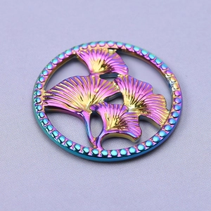 Detailed macro view of rainbow plated 304 stainless steel ginkgo leaf jewelry pendant