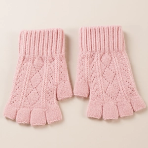 Close-up of pink cable knit arm warmers with diamond pattern and soft wool texture