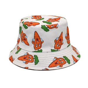 Detailed view of white bucket hat with cute orange carrot prints and reinforced stitching