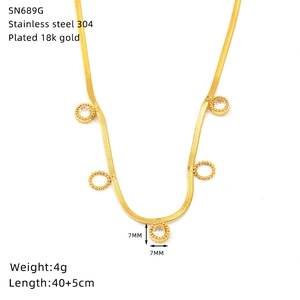 Close-up of gold stainless steel snake chain with zircon pendants and hollow circles