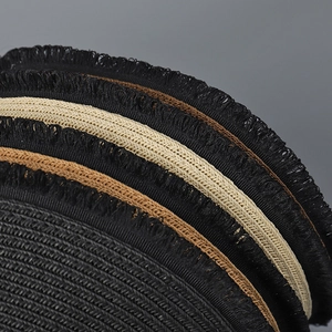 Foldable wide-brim sun visor with woven straw texture and stylish fringe detail