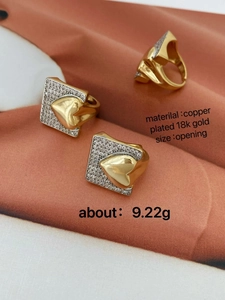 Detail of two-tone 18k gold plated copper heart ring with zircon paving and opening