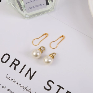 Delicate cream pearl pendants with rhinestone rings and gold gourd pins for gift bags