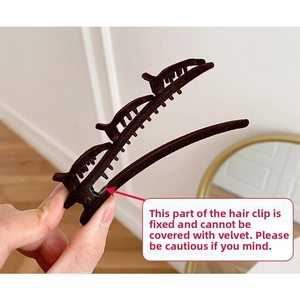Detail of the brown flocked hair claw clip with double-row teeth for secure styling