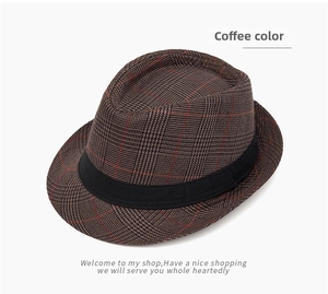 Detailed view of coffee-colored plaid jazz hat with woven texture and black grosgrain ribbon