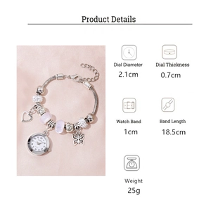 Montre bracelet perlé avec breloques cœur papillon argenté et perles lavande détail