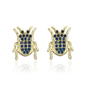 Detailed view of gold plated beetle stud earrings with blue and black zircon crystals