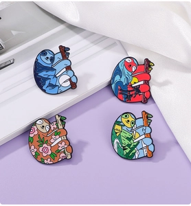 Detailed close-up of four colorful cartoon sloth enamel pins on a soft purple background