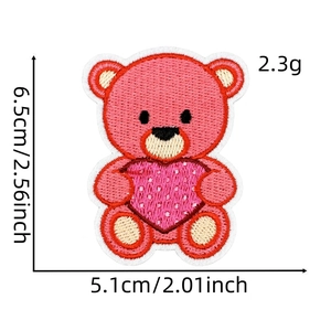 Detailed embroidery of a pink bear holding a heart patch with 6.5x5.1cm dimensions