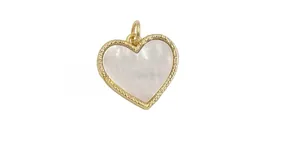 Detail of a heart-shaped gold pendant with white shell inlay and braided texture