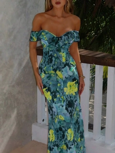 Detail of floral printed summer dress featuring v-neckline and ruffled chest decoration