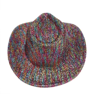 Detailed macro view of woven metallic thread texture on a colorful wide brim cowboy hat