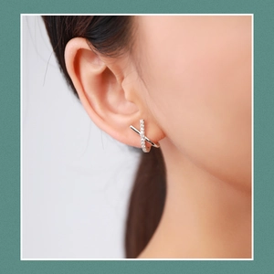 Elegant sterling silver X-shaped diamond stud earrings for women with minimalist design