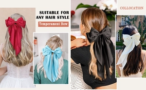 Detail showing oversized satin bow hair clips in four elegant colors with long ribbons