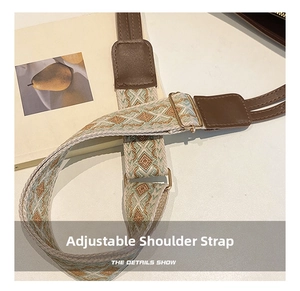 Detail of adjustable woven ethnic shoulder strap with leather ends and gold buckle