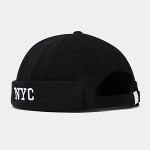Detail of black cotton NYC docker hat showing high-quality white embroidery and fabric texture