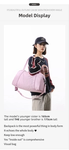 Close-up detail of a pink large capacity sports duffel bag carried by a female model