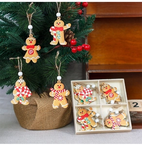 Detailed view of 12PCS wooden gingerbread man ornaments on tree and in gift box storage
