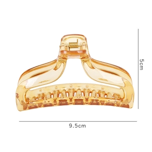 Detail view of amber hair claw clip with 9.5cm length and 5cm height dimensions