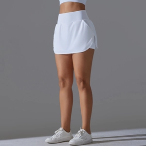 Close-up of white high-waisted tennis skort with side slit and hidden built-in pocket
