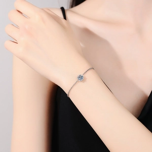 Elegant S925 silver snowflake bracelet featuring a brilliant round moissanite center stone