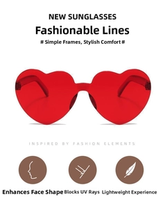 Macro detail of red heart-shaped sunglasses showing UV protection and lightweight frame