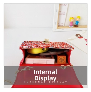 Internal display of mini crossbody tweed bag showing space for phone and makeup