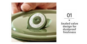 Detail of green ceramic bowl lid with airtight valve and freshness tracking dial