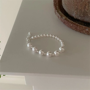 Detail of elegant 925 sterling silver pearl bracelet with adjustable lobster clasp closure