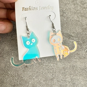 Halloween color-changing acrylic cat earrings with iridescent skull pattern on white card