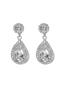 Macro shot of silver teardrop earrings with sparkling rhinestones and crystal details