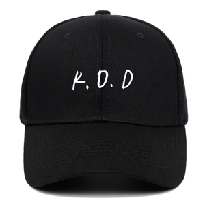 Classic black cotton baseball cap featuring white K.O.D embroidery in a minimalist style
