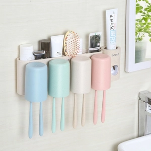 Portaspazzolino da muro con quattro bicchieri e dispenser automatico di dentifricio