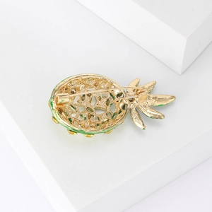 Sparkling pineapple brooch with yellow enamel and rhinestones on a minimalist white base