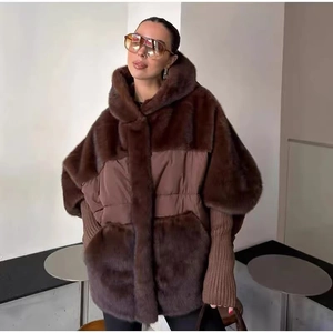 Detail of hooded brown jacket featuring plush faux fur patchwork and ribbed knit cuffs