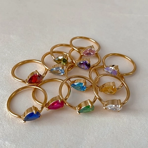 Elegant gold plated rings featuring multi-color pear cut zircon stones in a rainbow set
