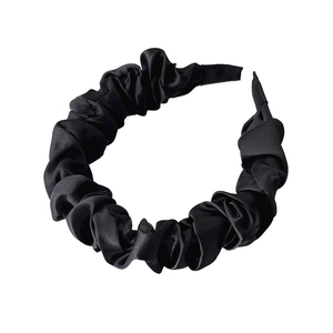 Minimalist black satin puffed pleated headband with an elegant smooth silk-like finish