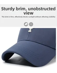 Detail of navy blue baseball cap brim with durable reinforced stitching and stiff texture