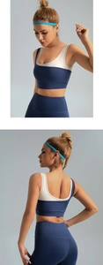 Detail of high-impact two-piece navy and cream color-block high-stretch yoga sports set