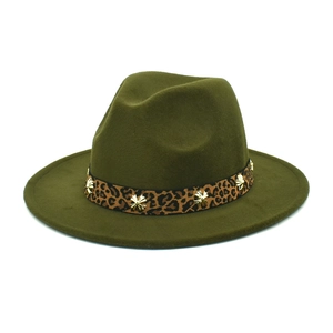 Detailed close-up of olive green wool fedora with leopard print band and gold star charms